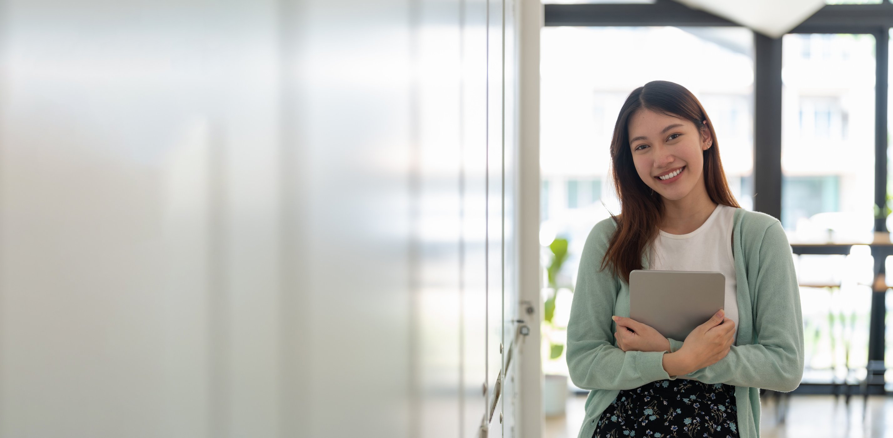 Portrait of young happy attractive asian student smiling and